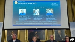The Nobel Committee for Physics at the Royal Swedish Academy of Sciences announce the winners of the 2011 Nobel Prize for physics in Stockholm, October 4, 2011.
