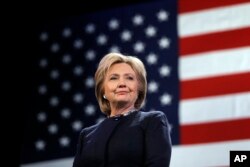 FILE - Then-Democratic presidential candidate Hillary Clinton is introduced during a campaign stop, Jan. 22, 2016, in Rochester, N.H.