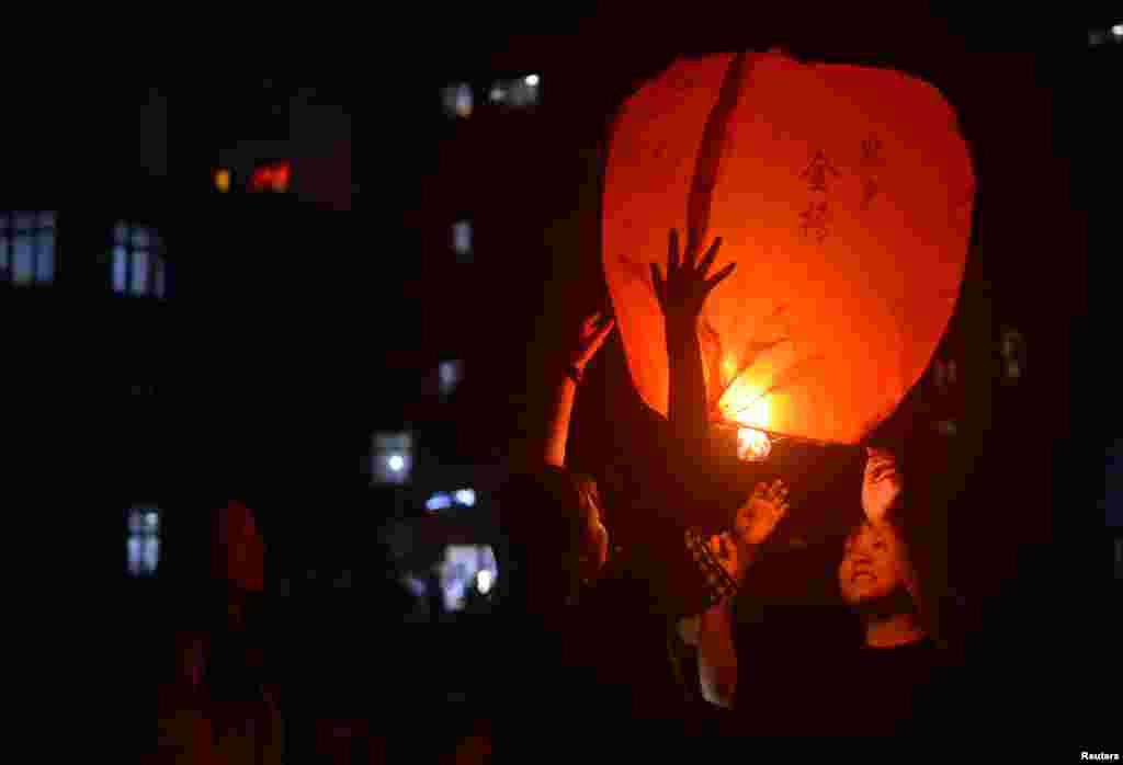 Students release a sky lantern to pray for the upcoming annual national college entrance examination, or &#39;gaokao&#39;, in Maotanchang town of Luan, Anhui province, China, June 4, 2019.