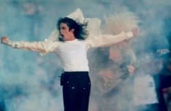 FILE - Michael Jackson performs during the halftime show at the Super Bowl XXVII in Pasadena, California, Jan. 31, 1993.