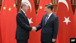 China's President Xi Jinping (R) greets Turkey's President Recep Tayyip Erdogan on the sidelines of a G-20 summit Sept. 3, 2016 in Hangzhou, China. Erdogan is expected to urge world leaders at the meeting to put terrorism high on its agenda.