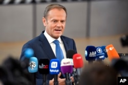 European Council President Donald Tusk speaks with the media as he arrives for an EU summit at the Europa building in Brussels, Belgium, April 29, 2017.