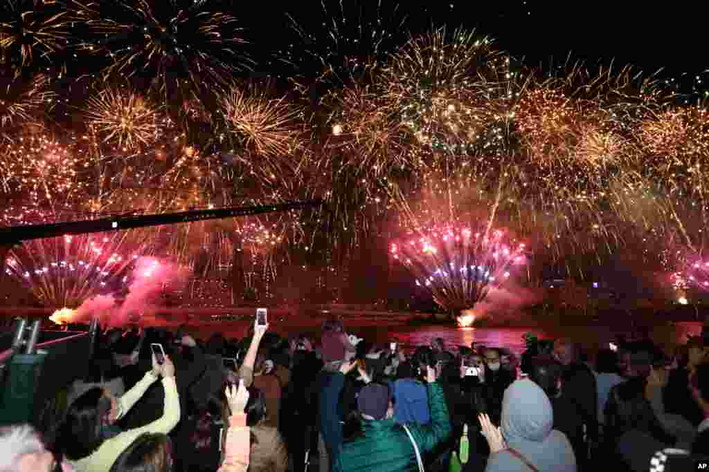 People celebrate in Brisbane, Australia, following an announcement by the International Olympic Committee that Brisbane was chosen to host the 2032 Olympics.