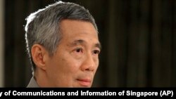 စင်္ကာပူဝန်ကြီးချုပ်ဟောင်း ကွယ်လွန်သူ လီကွမ်ယုရဲ့သားဖြစ်သူ လက်ရှိဝန်ကြီးချုပ် Lee Hsien Loong
