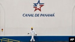 A worker walks next to the Miraflores Locks during a press tour of the Panama Canal in Panama City, June 25, 2016. The $5.25 billion expansion of the Panama canal is set to open Sunday.