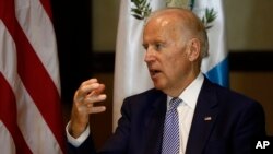 U.S. Vice President Joe Biden, right, speaks during a meeting with Guatemala's president-elect Jimmy Morales in Guatemala City, Jan 14, 2016.
