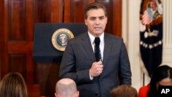 CNN journalist Jim Acosta does a standup before a new conference with President Donald Trump in the East Room of the White House in Washington, Nov. 7, 2018.