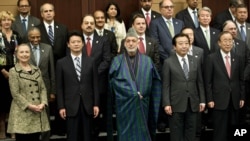 Participants at an international conference on Afghan civilian assistance pose for a group photo at a hotel in Tokyo, July 8, 2012. 