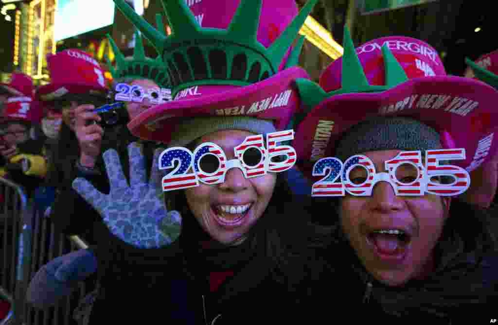 Revelers cheer in Times Square, New York, during the New Year&#39;s Eve celebration, Dec. 31, 2014.