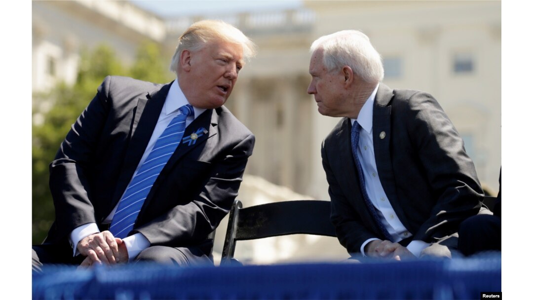 FILE - U.S. President Donald Trump speaks with Attorney General Jeff Sessions as they attend the National Peace Officers Memorial Service on the West Lawn of the U.S. Capitol in Washington, May 15, 2017.