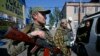 Cease-Fire Takes Hold in Ukraine as Russia Lashes Out at New Potential Sanctions
