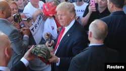 US Republican presidential candidate Donald Trump greets supporters at his campaign rally at Werner Enterprises Hangar in Omaha, Nebraska, May 6, 2016.