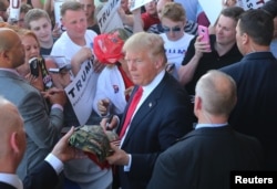 US Republican presidential candidate Donald Trump greets supporters at his campaign rally at Werner Enterprises Hangar in Omaha, Nebraska, US May 6, 2016.