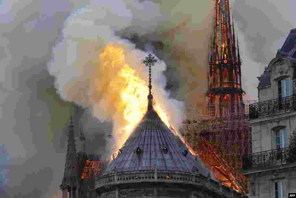 Flames burn the roof of the landmark Notre-Dame Cathedral in central Paris, France, where renovations are currently underway.