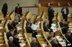 FILE - Russian lawmakers attend a session of the lower house of the State Duma in Moscow, Russia.