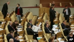 FILE - Russian lawmakers attend a session of the lower house of the State Duma in Moscow, Russia.