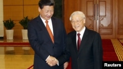 Chủ tịch Trung Quốc Tập Cận Bình và Tổng bí thư Nguyễn Phú Trọng trong một cuộc gặp ở Hà Nội hôm 5/11/2015. 