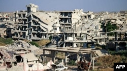 A picture taken on June 1, 2018, shows a view of destroyed buildings in a rebel-held area in the southern Syrian city of Daraa.