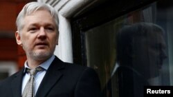 FILE - WikiLeaks founder Julian Assange makes a speech from the balcony of the Ecuadorian Embassy, in central London, Britain, Feb. 5, 2016. 