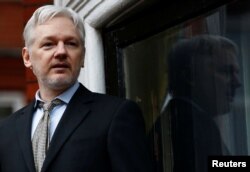 FILE - WikiLeaks founder Julian Assange makes a speech from the balcony of the Ecuadorian Embassy, in central London, Britain.