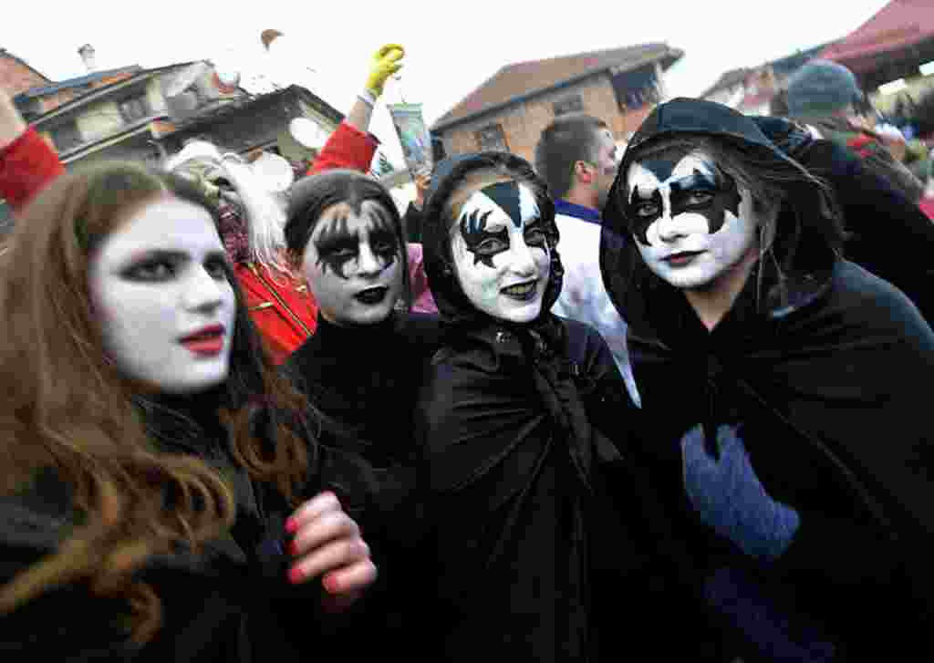 Disguised revelers participate in a carnival procession through southwestern Macedonia's village of Vevcani (AP Photo)