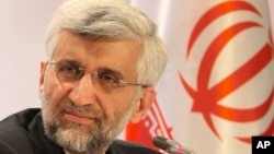 Sekretaris Dewan Keamanan Nasional Tertinggi di Iran dan kepala perunding utama program nuklir Saeed Jalili dalam jumpa pers di Kazakhstan. (AP/Pavel Mikheyev)