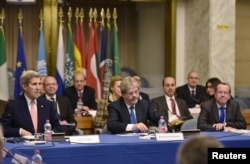 U.S. Secretary of State John Kerry (L), Italy's Foreign Minister Paolo Gentiloni (front C) and United Nation's envoy Martin Kobler (front R) take part in an international conference at the Ministry of Foreign Affairs in Rome, Dec. 13, 2015.