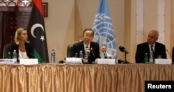 U.N. chief Ban Ki-moon, center, calls for peace during a meeting in Tripoli, Libya, on Oct. 11, 2014.