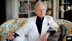 FILE - American author and journalist Tom Wolfe appears in his living room during an interview in New York, July 26, 2016.