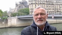 "Our heart is bleeding," says former Paris firefighter Philippe Facquet, the day after the devastating fire at Notre Dame cathedral, April 16, 2019. (L. Bryant/VOA)