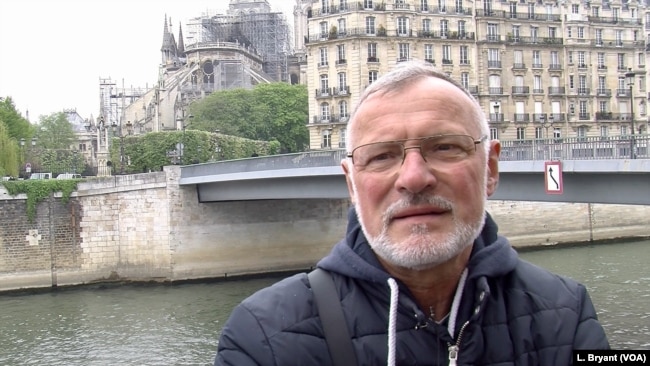 "Our heart is bleeding," says former Paris firefighter Philippe Facquet, the day after the devastating fire at Notre Dame cathedral, April 16, 2019. (L. Bryant/VOA)