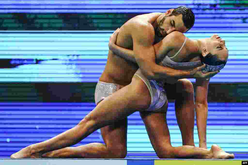 Brazil&#39;s Giovana Stephan and Brazil&#39;s Renan Souza compete in the mixed duet free artistic swimming event during the 2019 World Championships at Yeomju Gymnasium in Gwangju, South Korea.