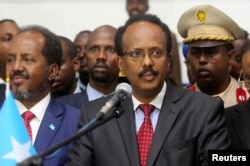 FILE - Somalia's President Mohamed Abdullahi Farmajo addresses lawmakers after his election victory in Mogadishu, Feb. 8, 2017. Mohamed was prime minister during the nation's 2011 famine disaster.