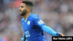 Leicesters' Riyad Mahrez celebrates after scoring during he English Premier League soccer match between Leicester City and Swansea City at the King Power Stadium in Leicester, England, Sunday, April 24, 2016. 