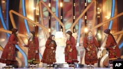A Russian group known as the Buranovo Grannies, pose after winning a song contest in Moscow and the right to represent the country at this year's Eurovision Song Contest, March 7, 2012. 