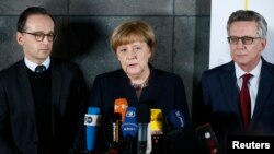 German Chancellor Angela Merkel, Justice Minister Heiko Maas (left) and Interior Minister Thomas de Maiziere during a statement after visiting the Bundeskriminalamt Federal Crime Office Police in Berlin, Germany, Dec. 22, 2016.
