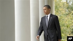President Obama walks to the White House Rose Garden, Oct. 20, 2011 (file photo).