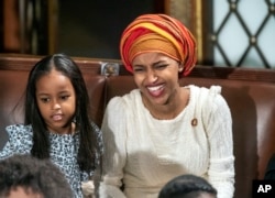 Rep. Ilhan Omar, a freshman Democrat representing Minnesota's 5th Congressional District, smiles as the House of Representatives assembles for the first day of the 116th Congress at the Capitol in Washington, Jan. 3, 2019.