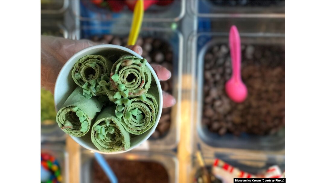 Making rolled ice cream, a Thai street food 