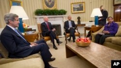 President Barack Obama, center, meets with, from left, Secretary of State John Kerry and Vice President Joe Biden and National Security Adviser Susan Rice, in the Oval Office of the White House in Washington, Jan. 7, 2015. 