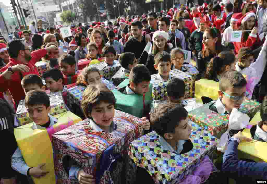 Students dressed up as Christmas gifts take part in a Christmas parade in Beirut, Lebanon.