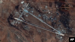 This Oct. 7, 2016 satellite image released by the U.S. Department of Defense shows Shayrat air base in Syria. The U.S. blasted a Syrian air base with a barrage of cruise missiles on April 7, 2017 in fiery retaliation for this week's gruesome chemical weap