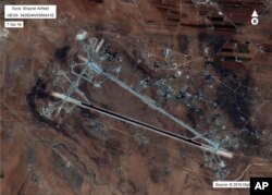 FILE - This Oct. 7, 2016, satellite image released by the U.S. Department of Defense shows the al-Shayrat air base in Syria. The U.S. blasted a Syrian air base with a barrage of cruise missiles on April 7, 2017.