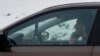 FILE -A motorist talks on a cell phone while driving on an expressway in Chicago, Dec. 19, 2013. 
