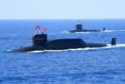 资料照：中国海军094A晋级弹道导弹战略核潜艇在南中国海参加军事表演。（2018年4月12日）