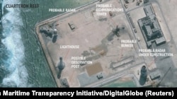 FILE - A satellite image released by the Asian Maritime Transparency Initiative at Washington's Center for Strategic and International Studies shows construction of possible radar tower facilities in the Spratly Islands in the disputed South China Sea in this im