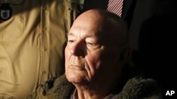 In this May 12. 2011 file picture John Demjanjuk waits in a courtroom in Munich. 