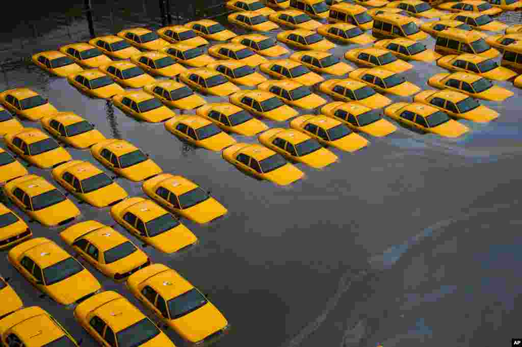October 30: A parking lot full of yellow cabs is flooded as a result of superstorm Sandy in Hoboken, New Jersey.
