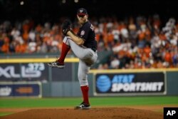 Washington Nationals starting pitcher Stephen Strasburg throws during the first inning of Game 6 of the baseball World Series against the Houston Astros Tuesday, Oct. 29, 2019, in Houston. (AP Photo/Matt Slocum)