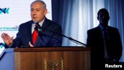 FILE - Israeli Prime Minister Benjamin Netanyahu speaks during a dedication ceremony of the "Assuta" hospital in Ashdod, Israel, Dec. 21, 2017. 
